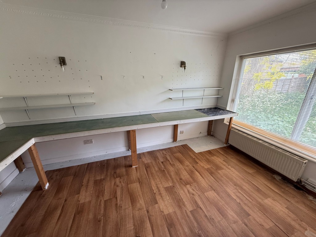 Lot: 136 - FOUR-BEDROOM DETACHED HOUSE FOR REPAIR AND MODERNISATION - Second reception off the living room with desk like storage